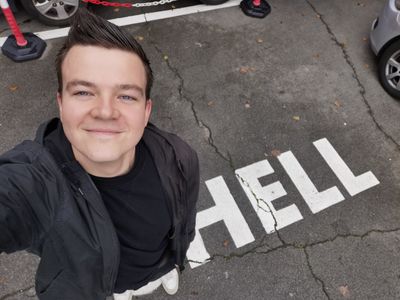 Selfie from above. Manuel’s looking up smiling. On the floor next to me HELL written in large letters.